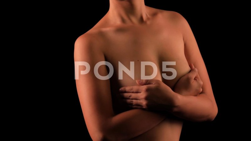 Female breasts covered with hand