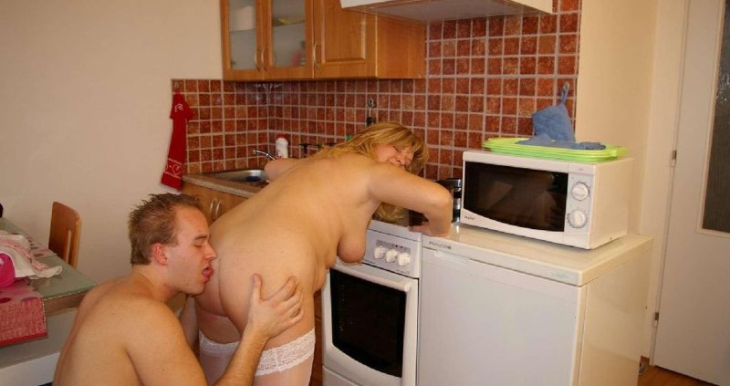 Naked mature in the kitchen