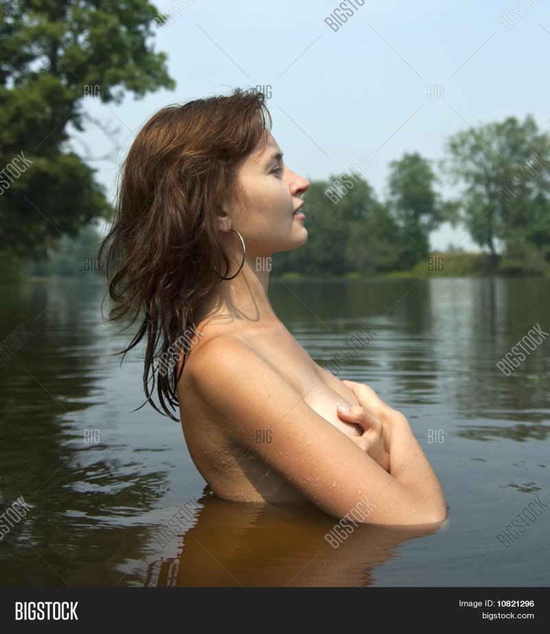 Girls swim in the river