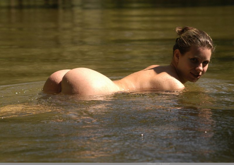 Girls swim in the river