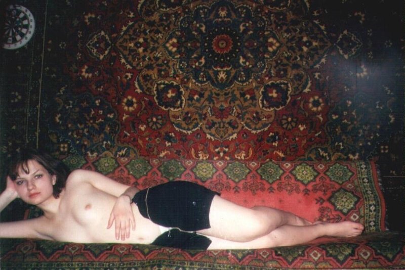 Naked women against the backdrop of carpets
