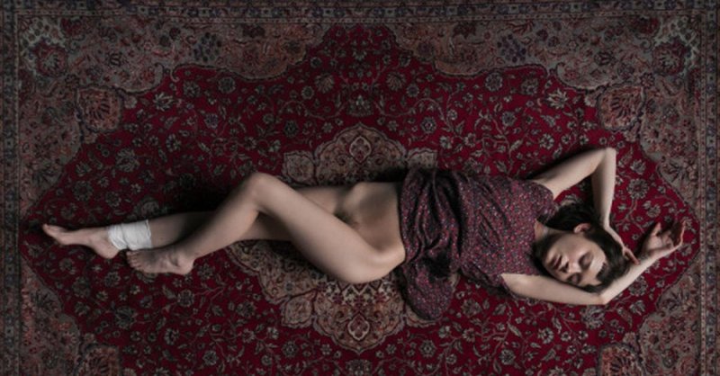 Girl naked on the carpet