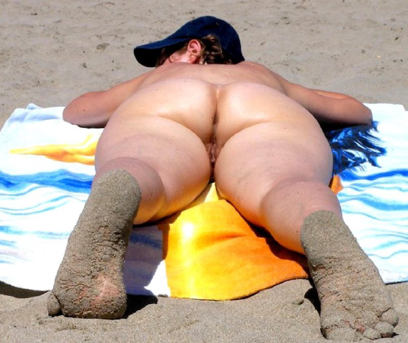 Naked thick buttocks on the beach