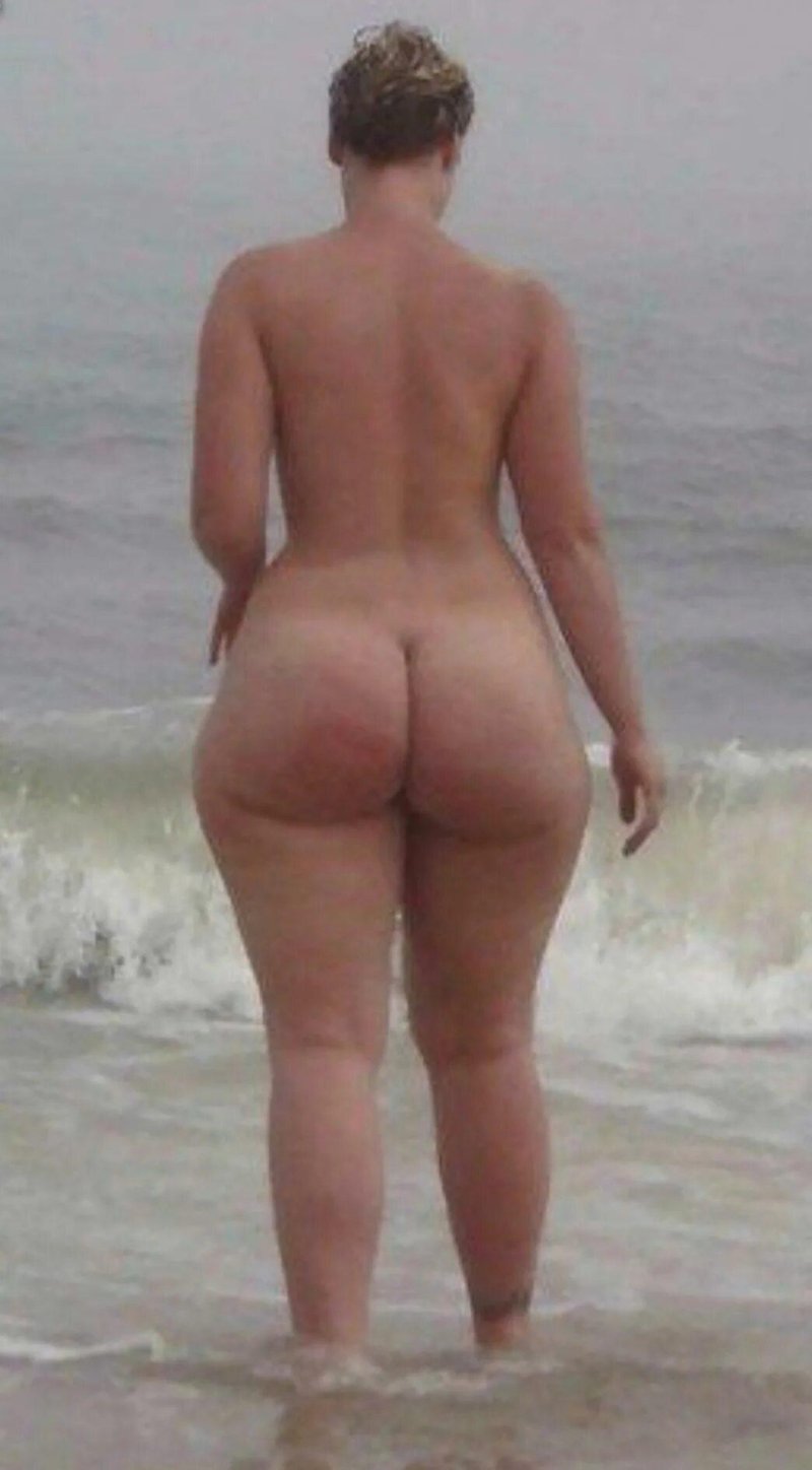 Naked women on the beach behind