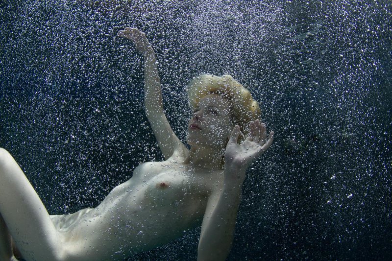 Naked women under water