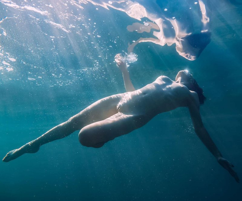 Beautiful naked women under water