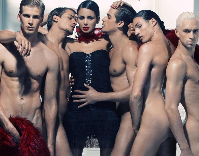 Woman surrounded by men