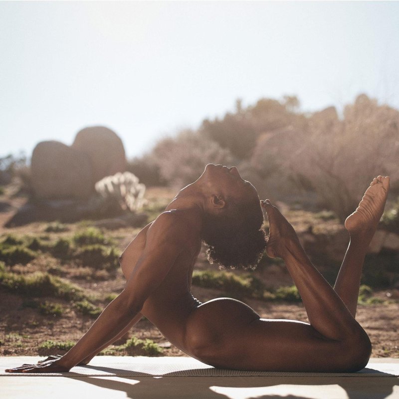 Naked yoga on the seashore