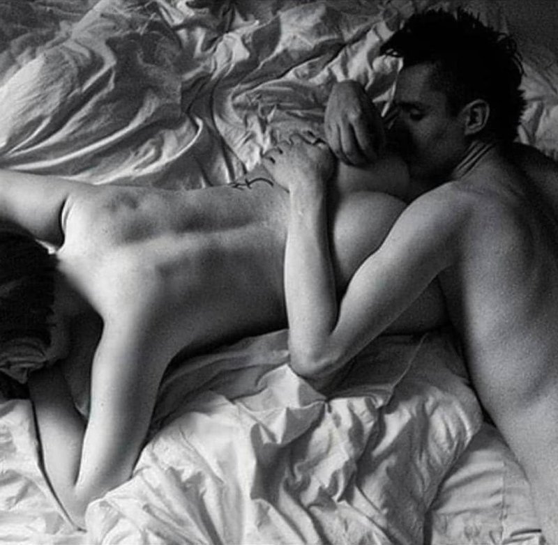 Man and woman naked in bed