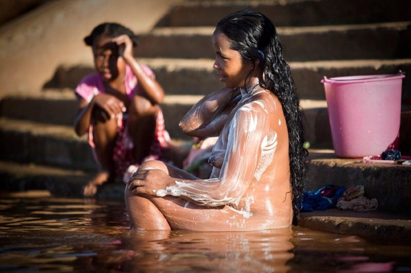 Naked women wash in the Gang River
