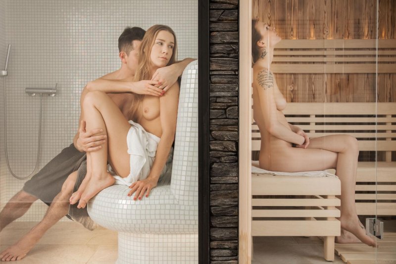 Naked men and women in the bath