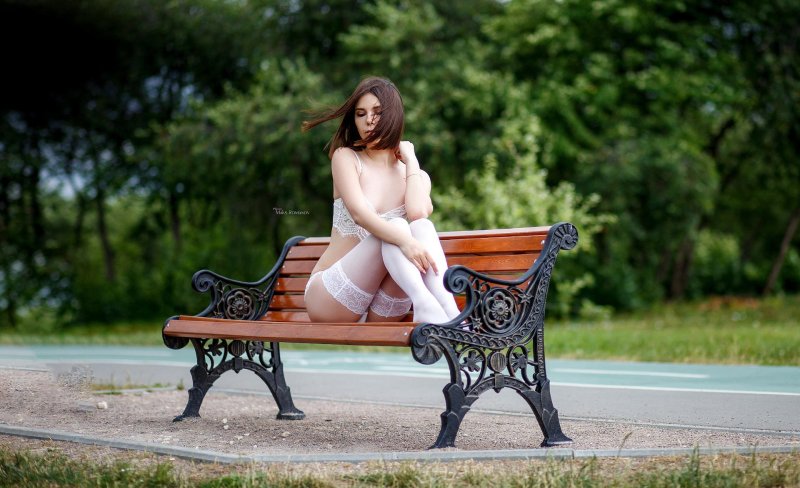 Naked woman on a bench